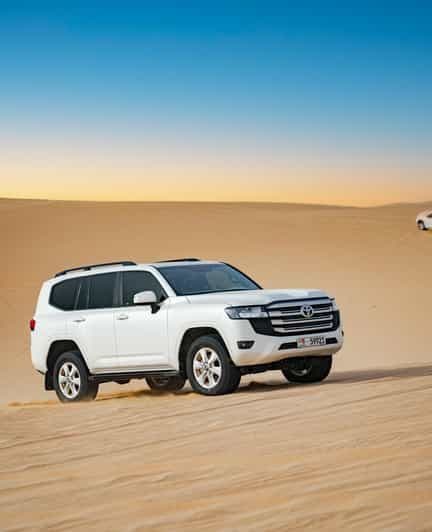 Billet Abu Dhabi : Promenade matinale dans les dunes, balade à dos de chameau et surf des sables