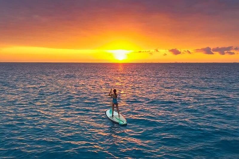 Sunrise paddleboard session de groupe mer des Caraïbes. Foto inclus !